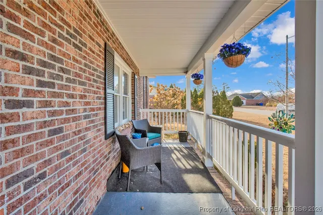 a view of a chairs and table in a balcony