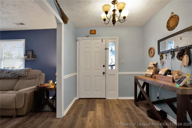 a view of livingroom with furniture and wooden floor