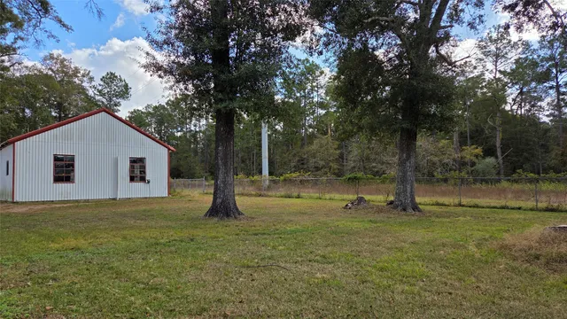 a backyard of a house with lots of green space