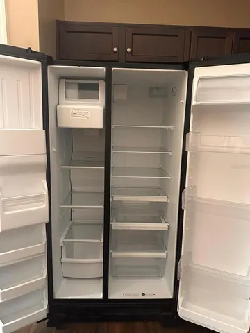 view of a room with wooden floor and windows