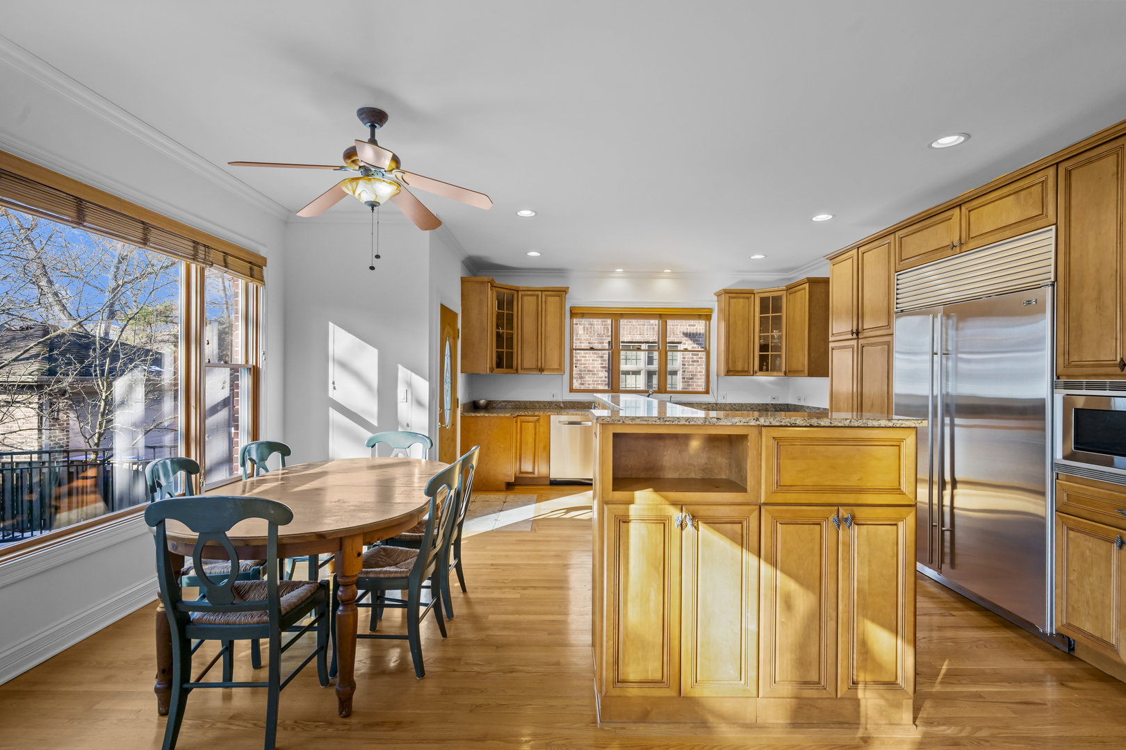 516 Drexel Avenue Glencoe, IL 60022 - Photo 12 of 32 a view of a dining room with furniture and a kitchen view