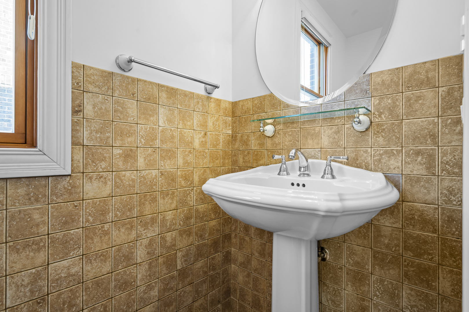 516 Drexel Avenue Glencoe, IL 60022 - Photo 13 of 32 a bathroom with a sink and a mirror