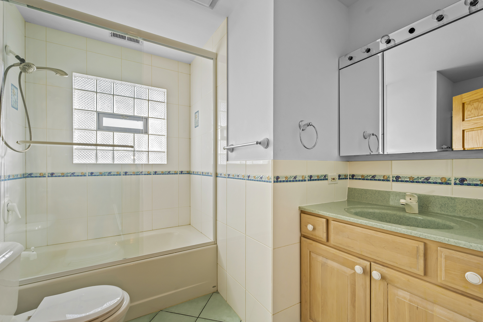 516 Drexel Avenue Glencoe, IL 60022 - Photo 19 of 32 a bathroom with a sink a toilet and shower