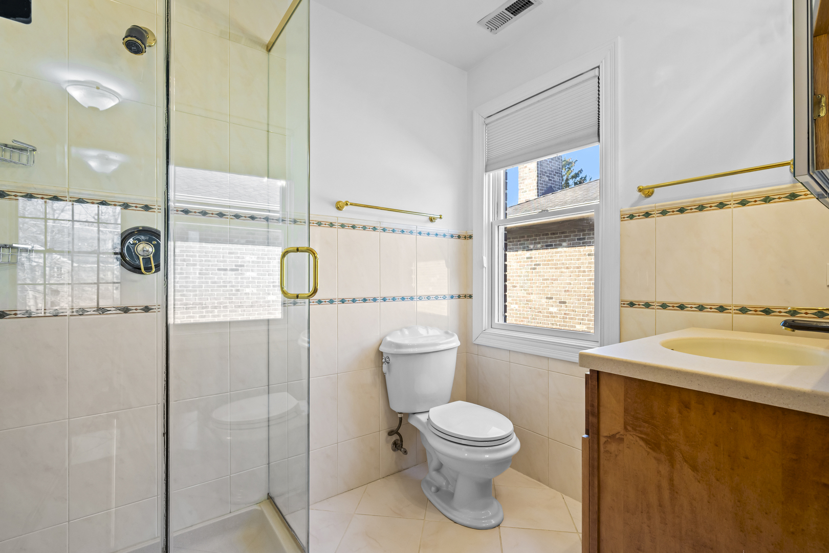 516 Drexel Avenue Glencoe, IL 60022 - Photo 21 of 32 a bathroom with a sink a toilet and shower