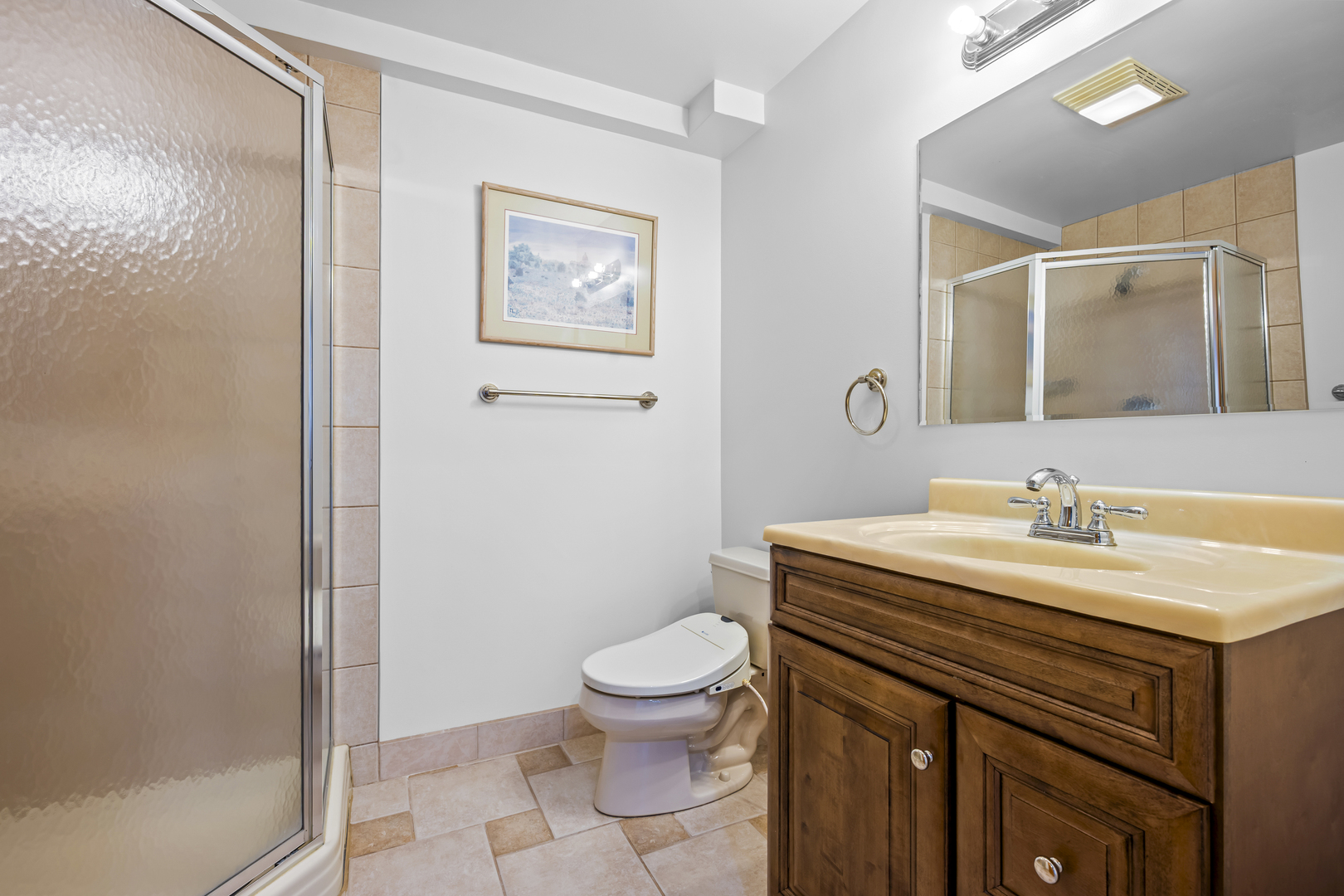 516 Drexel Avenue Glencoe, IL 60022 - Photo 25 of 32 a bathroom with a granite countertop sink a toilet and a mirror