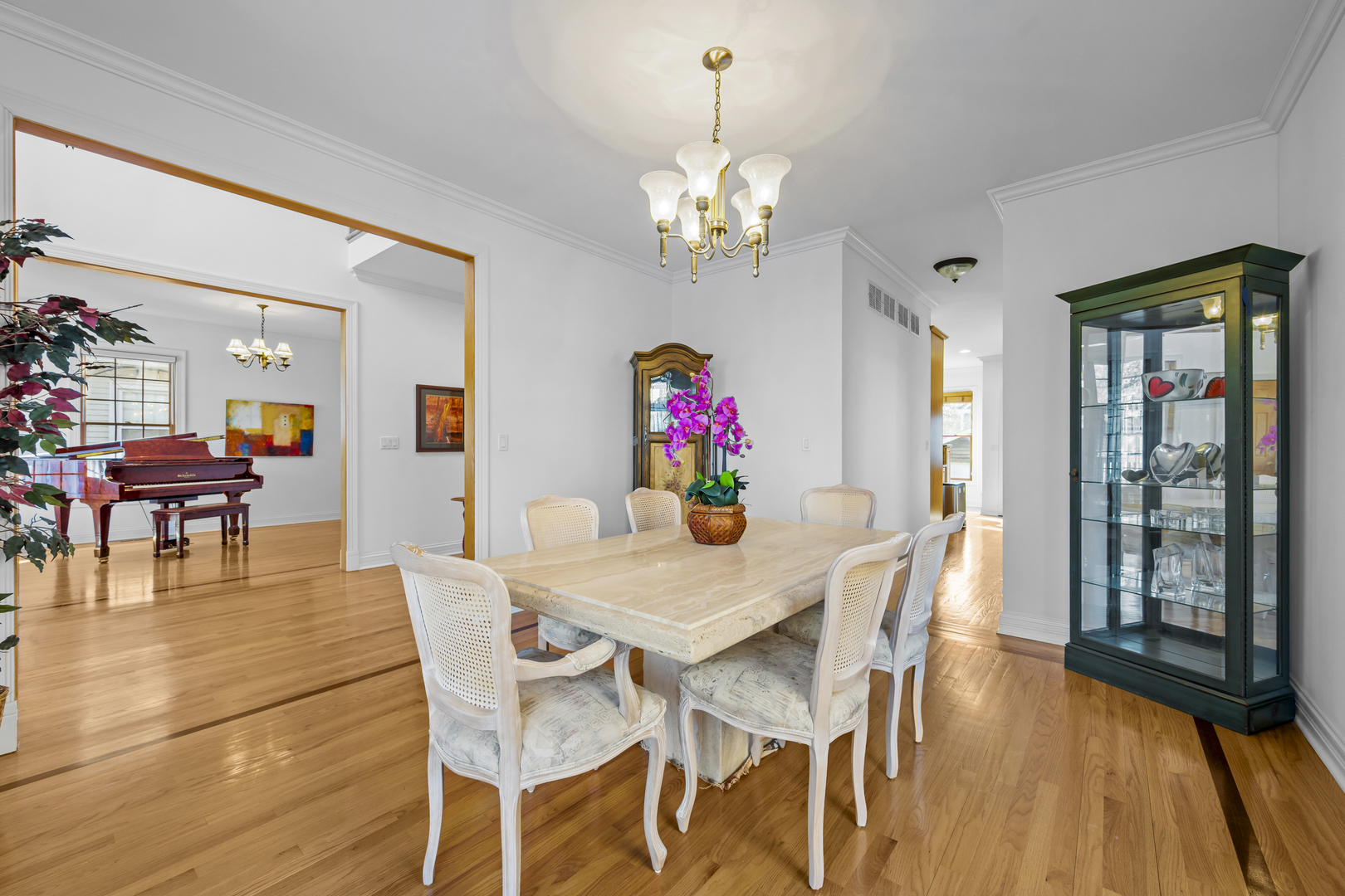 516 Drexel Avenue Glencoe, IL 60022 - Photo 6 of 32 a view of a dining room with furniture wooden floor and chandelier