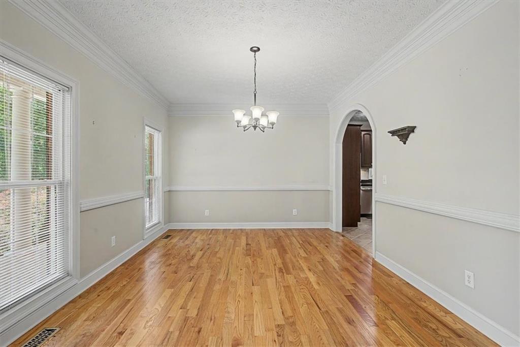 1136 Cole Lake Road Dallas, GA 30157 - Photo 27 of 72 a view of empty room with wooden floor and fan
