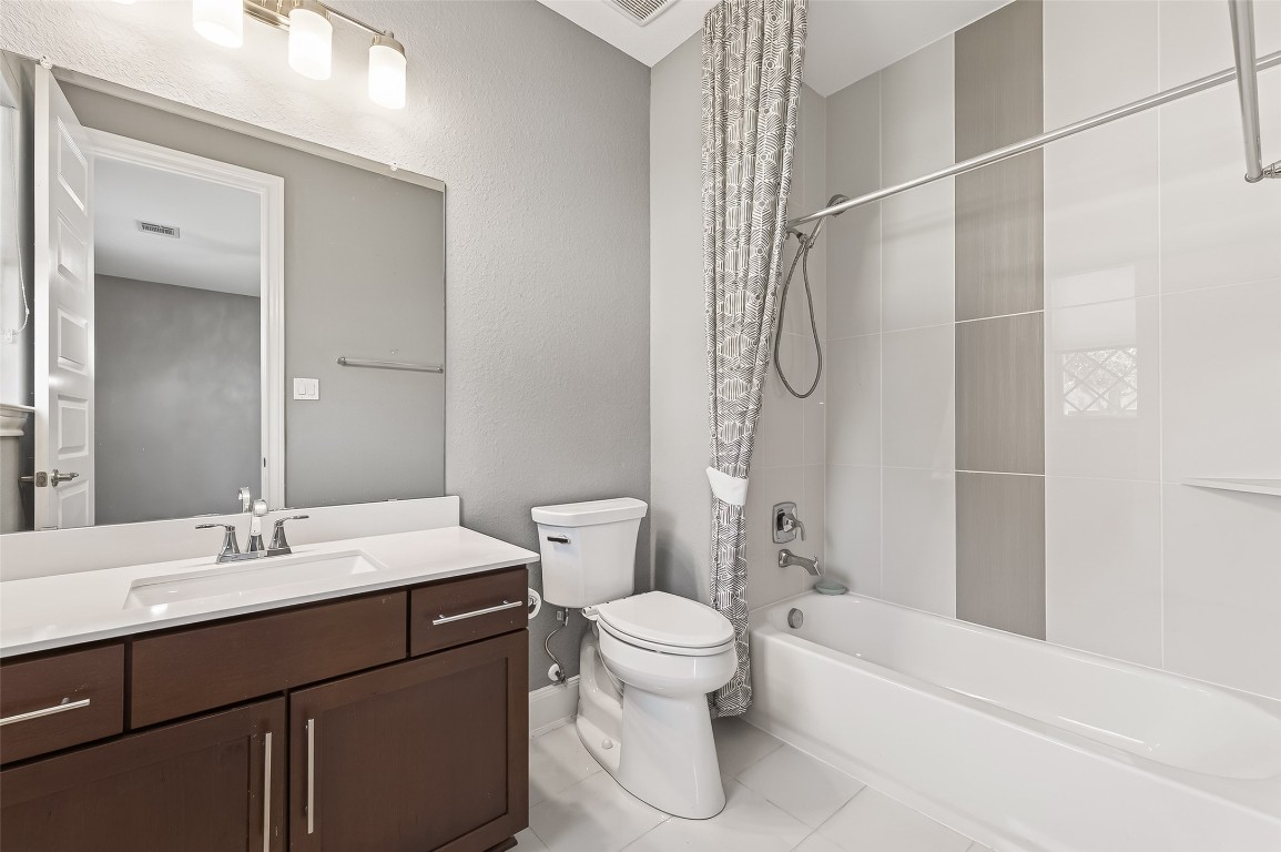 51 Scepter Ridge Sugar Land, TX 77498 - Photo 11 of 46 a bathroom with a sink a toilet and shower