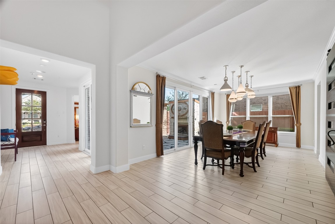 51 Scepter Ridge Sugar Land, TX 77498 - Photo 45 of 46 a view of a dining room with furniture and wooden floor
