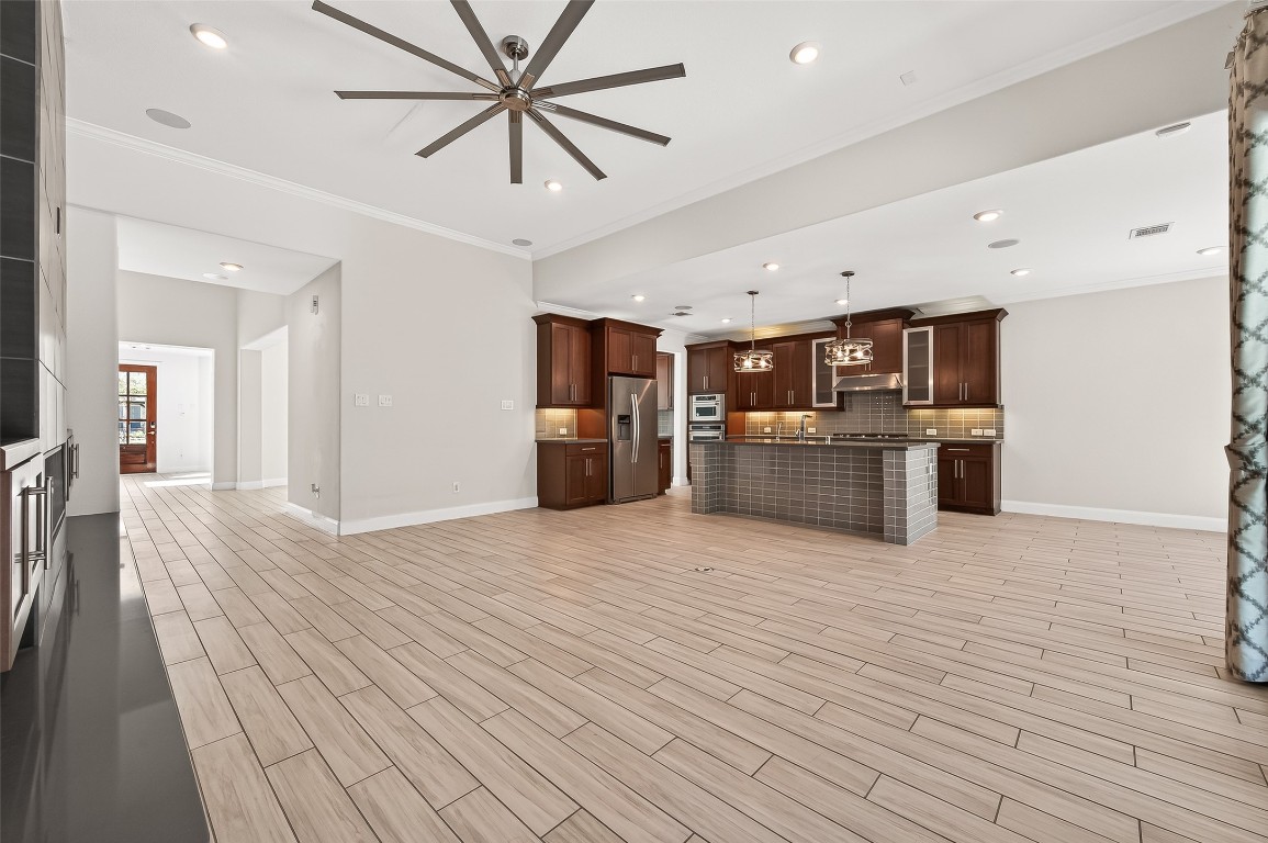 51 Scepter Ridge Sugar Land, TX 77498 - Photo 46 of 46 a large kitchen with stainless steel appliances granite countertop a refrigerator and a sink