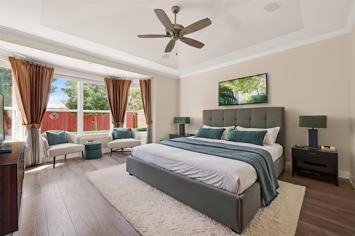 51 Scepter Ridge Sugar Land, TX 77498 - Photo 25 of 46 a bedroom with a large bed couch and a large window