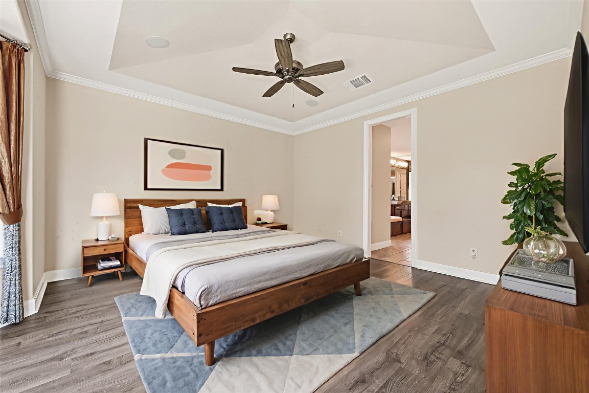 51 Scepter Ridge Sugar Land, TX 77498 - Photo 26 of 46 a bedroom with a bed and a potted plant