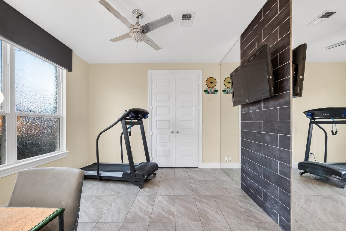 51 Scepter Ridge Sugar Land, TX 77498 - Photo 31 of 46 a view of a room with gym equipment
