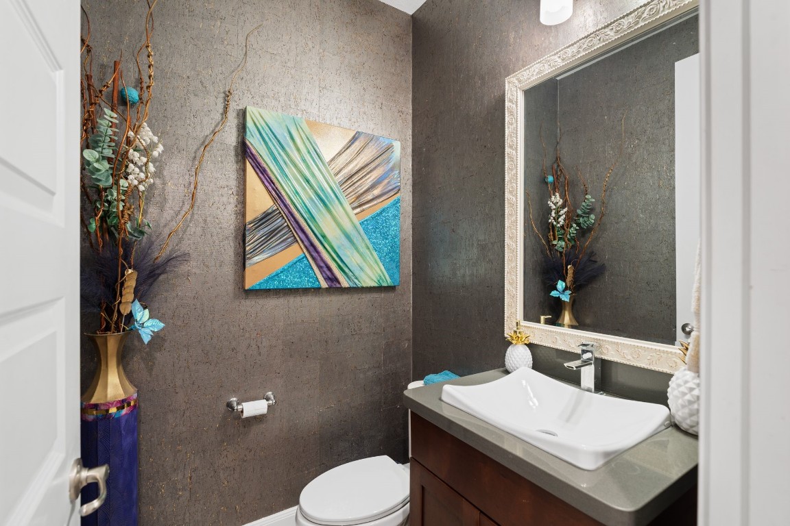 51 Scepter Ridge Sugar Land, TX 77498 - Photo 32 of 46 a bathroom with a sink mirror and toilet