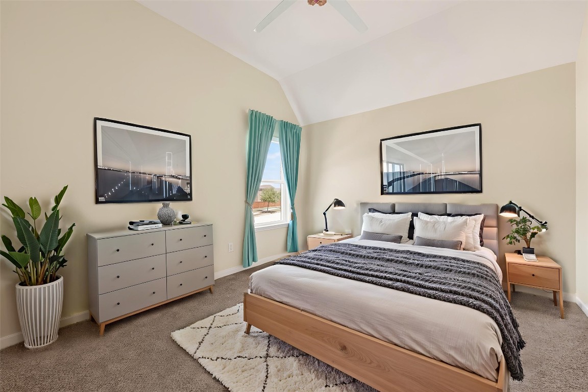 51 Scepter Ridge Sugar Land, TX 77498 - Photo 40 of 46 a bedroom with a large bed and a potted plant