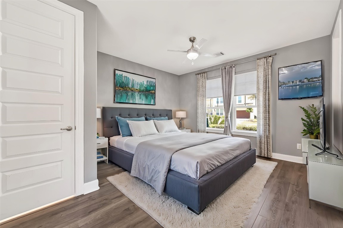 51 Scepter Ridge Sugar Land, TX 77498 - Photo 9 of 46 a spacious bedroom with a large bed a chandelier and windows