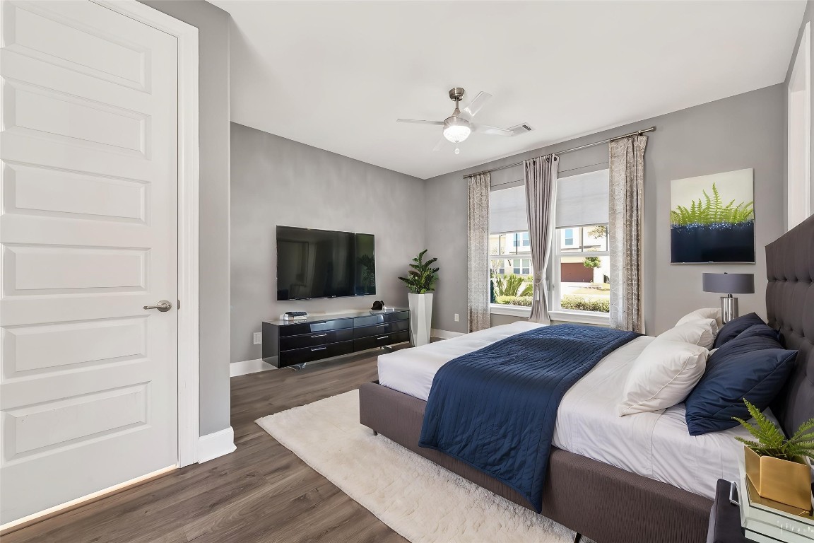 51 Scepter Ridge Sugar Land, TX 77498 - Photo 10 of 46 a bedroom with a bed and a flat screen tv