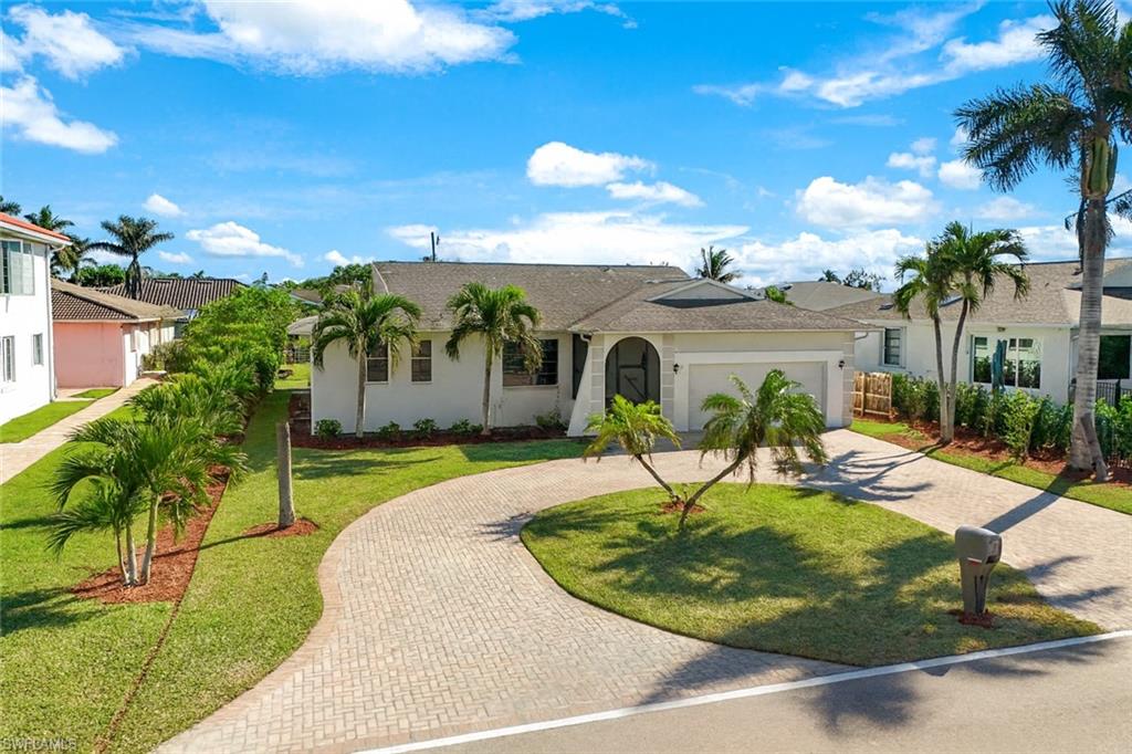 a view of a swimming pool with a yard