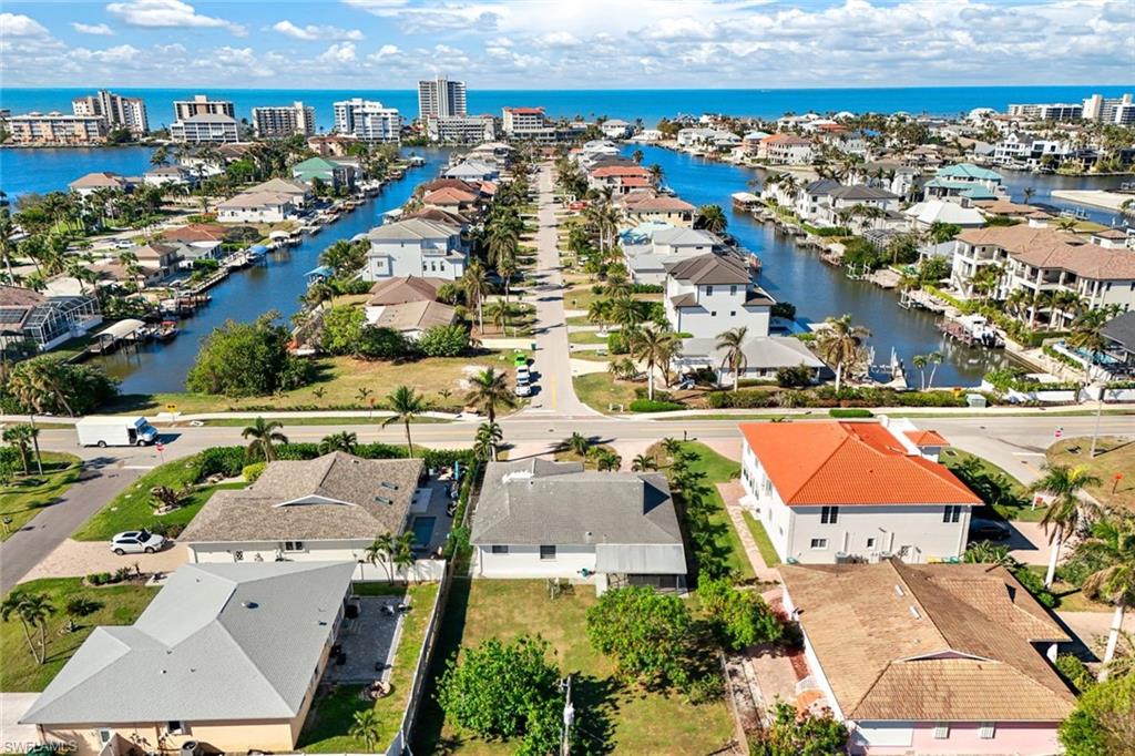 9940 Vanderbilt Drive Naples, FL 34108 - Photo 13 of 14 an aerial view of residential houses with outdoor space