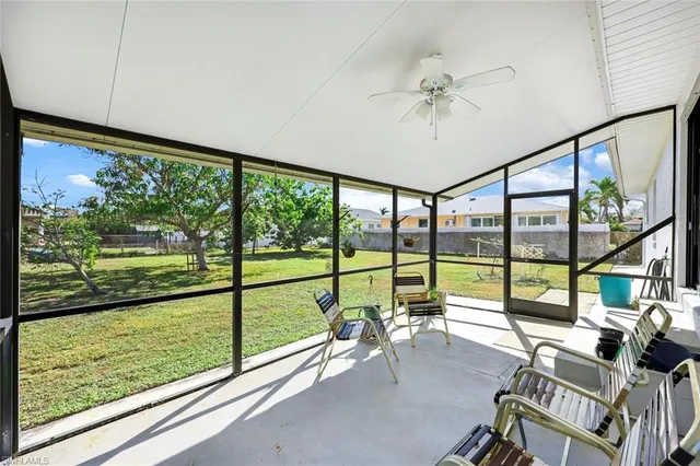a large dining space with furniture and a kitchen view