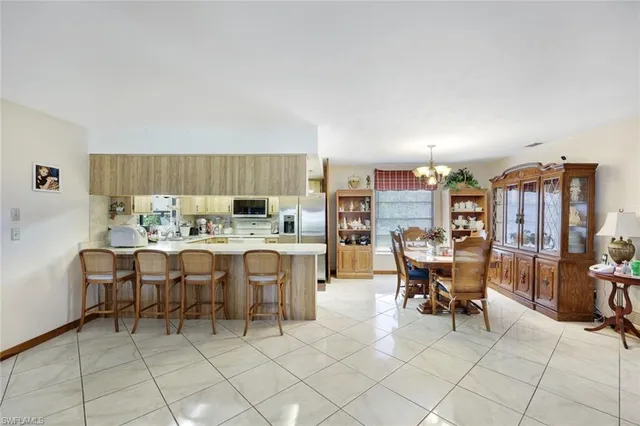 a living room with furniture a rug and a window