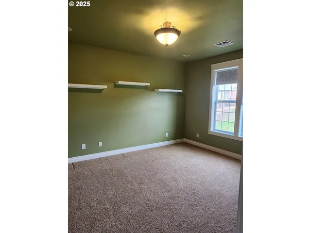 a view of a room with a hallway