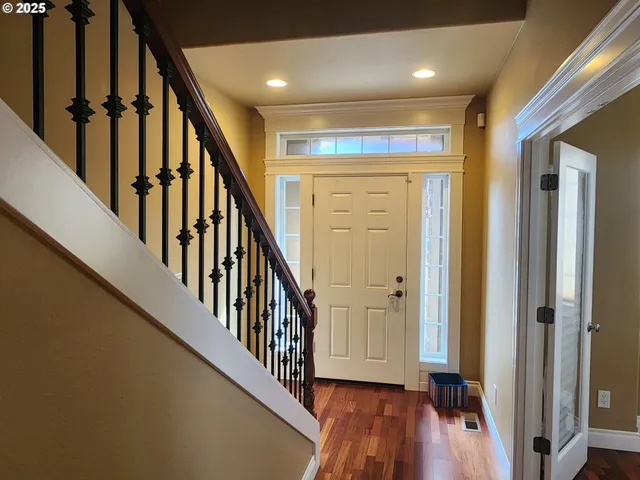 wooden view of an entryway with wooden floor
