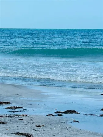 an aerial view of beach and ocean
