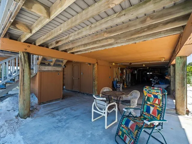 a view of a balcony with furniture