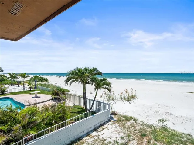 a view of a house with a yard patio and a slide