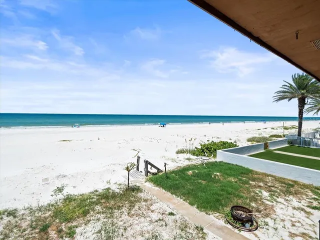 a house view with a seating space and garden