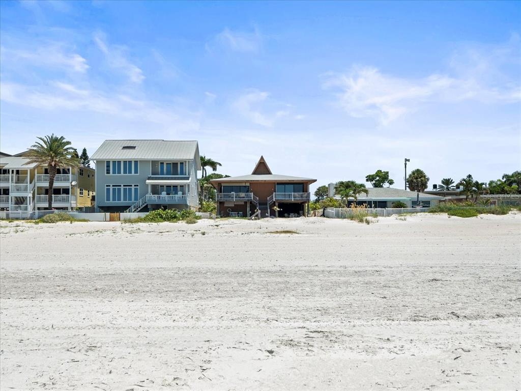 18218 Sunset Boulevard, Unit A St. Petersburg, FL 33708 - Photo 20 of 48 a view of a lake with a big yard