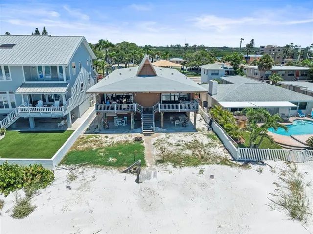 an aerial view of a house with a garden and plants