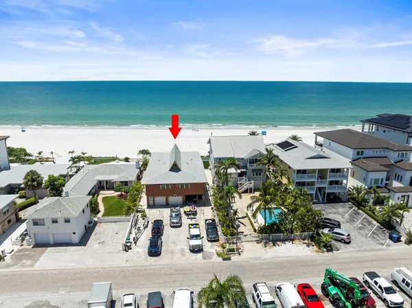 an aerial view of houses with outdoor space