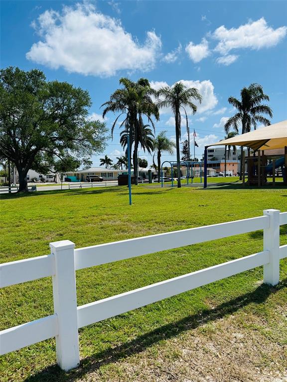 18218 Sunset Boulevard, Unit A St. Petersburg, FL 33708 - Photo 22 of 48 a view of a golf course with a garden