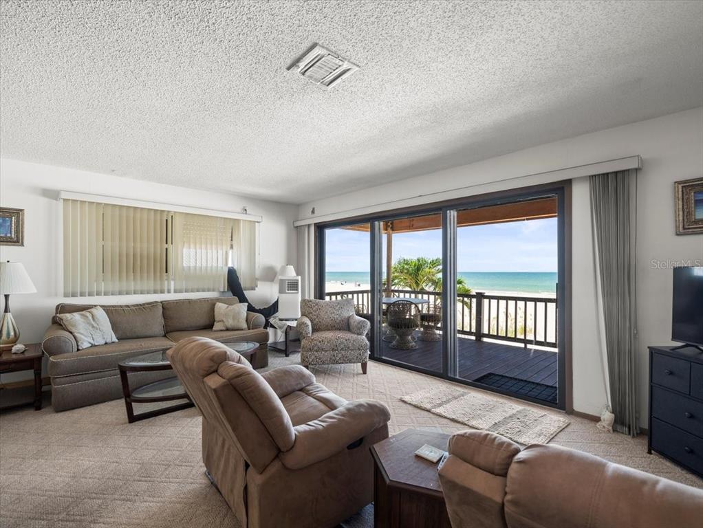 18218 Sunset Boulevard, Unit A St. Petersburg, FL 33708 - Photo 30 of 48 a living room with furniture and a window