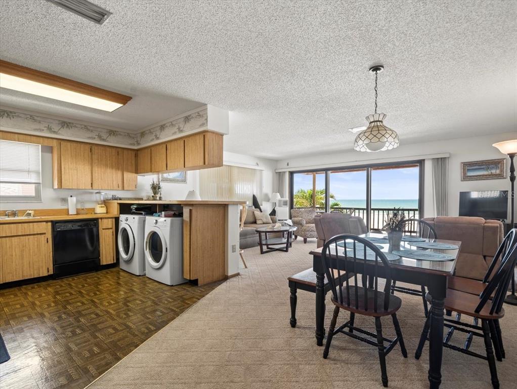 18218 Sunset Boulevard, Unit A St. Petersburg, FL 33708 - Photo 36 of 48 a view of a dining room with furniture window and outside view