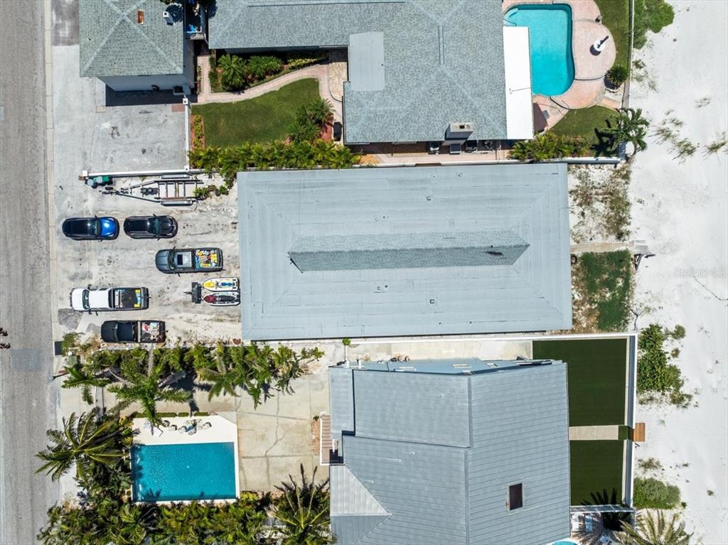 18218 Sunset Boulevard, Unit A St. Petersburg, FL 33708 - Photo 45 of 48 an aerial view of a house with a yard