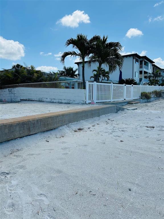 18218 Sunset Boulevard, Unit A St. Petersburg, FL 33708 - Photo 9 of 48 a view of a yard in front of a house