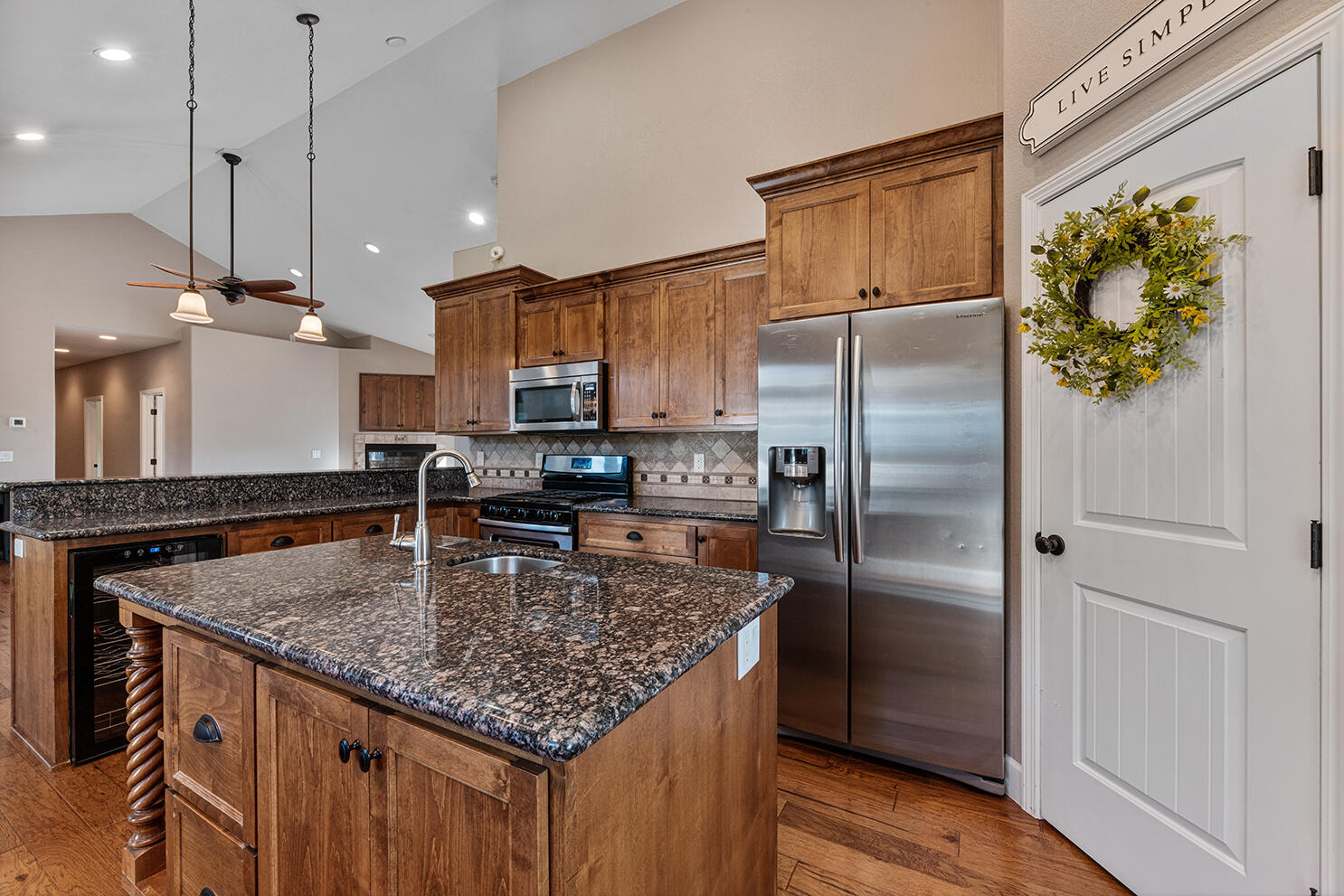 72 Pineridge Lane Eagle Point, OR 97524 - Photo 13 of 34 a kitchen with stainless steel appliances granite countertop a refrigerator a sink and a refrigerator