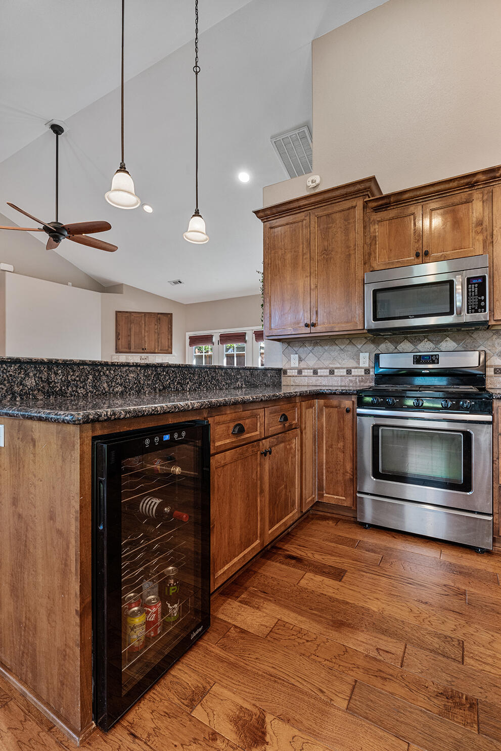 72 Pineridge Lane Eagle Point, OR 97524 - Photo 14 of 34 a kitchen with stainless steel appliances granite countertop a stove a sink and a microwave