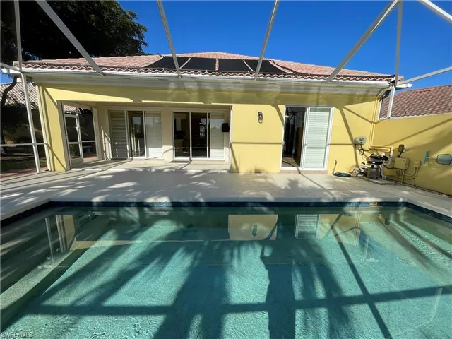 a view of swimming pool with a patio