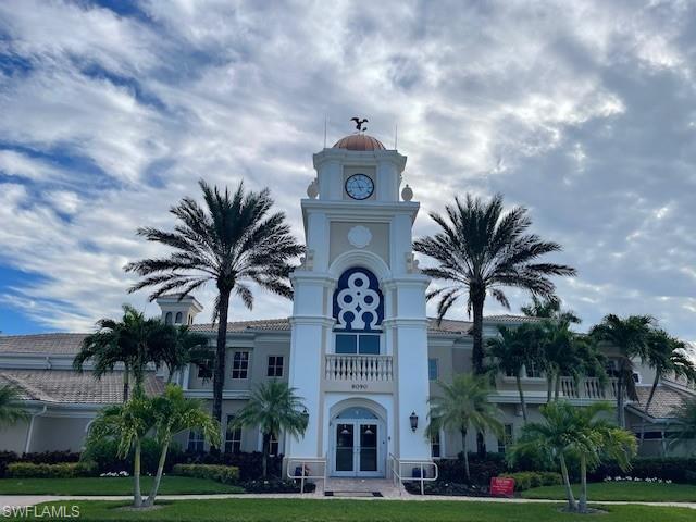 7304 Carducci Court Naples, FL 34114 - Photo 26 of 40 a front view of a house with a garden
