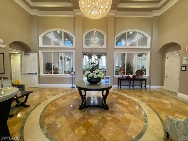 a view of a living room and a chandelier