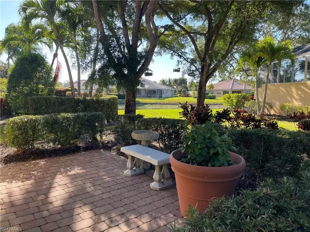 a view of a backyard with garden and plants