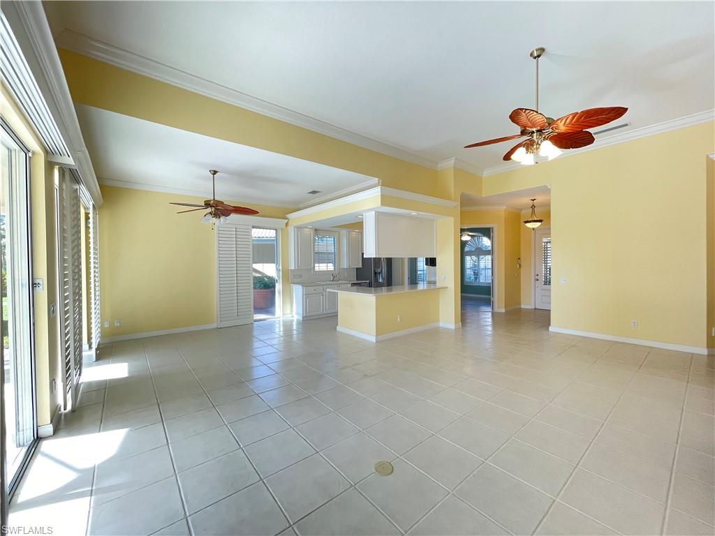 7304 Carducci Court Naples, FL 34114 - Photo 8 of 40 a view of a kitchen with a sink and refrigerator
