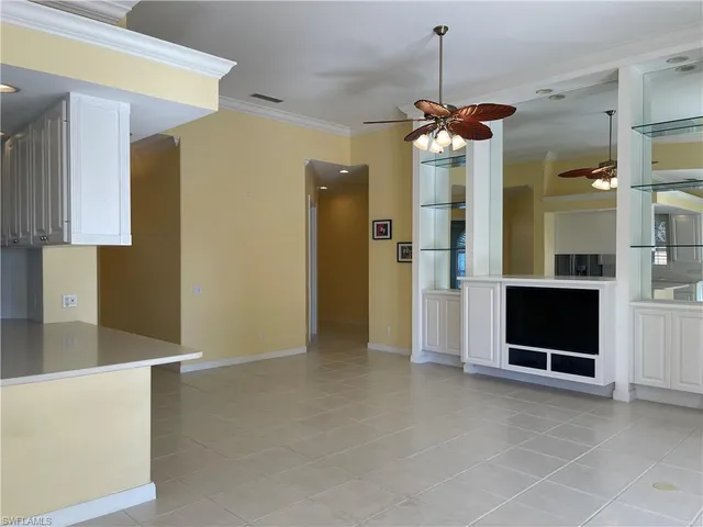 a view of a kitchen with a sink and a refrigerator