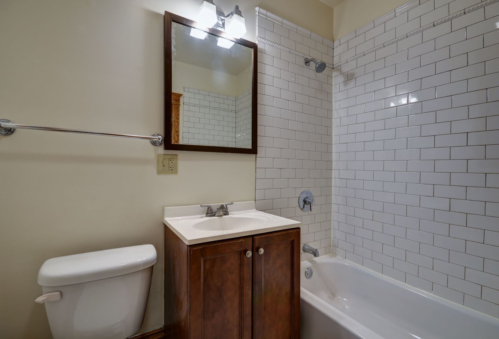 3722 North Fremont Street, Unit 2 Chicago, IL 60613 - Photo 16 of 16 a bathroom with a sink toilet and shower