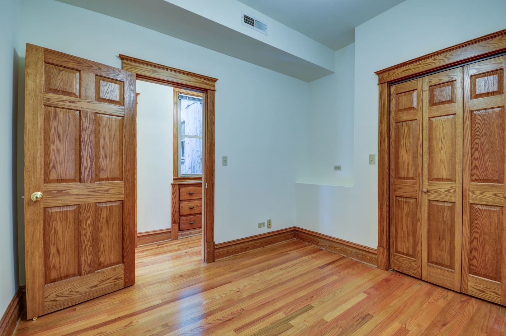 3722 North Fremont Street, Unit 2 Chicago, IL 60613 - Photo 9 of 16 wooden floor and windows in a room