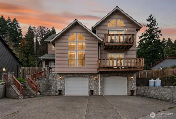 a front view of a house with a garage
